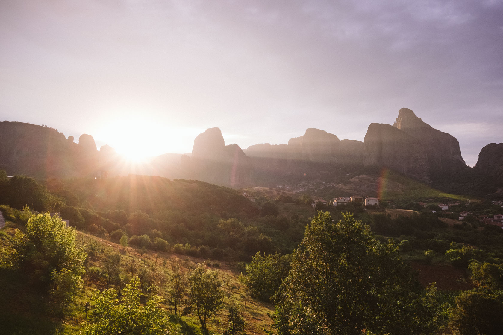 Meteora, Greece travel tips including places to visit, landscape photography locations, the best monasteries, and other information. Meteora, Greece at sunrise